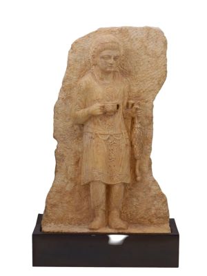 A MARBLE FRIEZE OF A MAN HOLDING A SKYPHOS, CA. 1ST-3RD CENTURY AD. A marble frieze depicting a