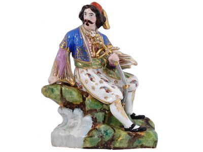 A PORCELAIN FIGURE OF A SEATED OTTOMAN NOBLEMAN, 19TH CEN. A porcelain figurine, depicting a 