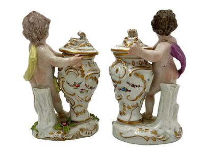 A PAIR OF FRENCH PORCELAIN PUTTI FIGURINES, 19TH C. A pair of French porcelain putti figurines 