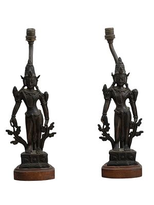 A PAIR OF NEPALESE BRONZE LAMPS IN THE SHAPE OF DEITIES, 20TH CEN. Two bronze lamps of Nepalese 