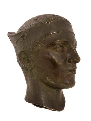 A SCHLEIFFER BRONSE HEAD OF A YOUTH, CA. 1930. A life-size bronze cast of the head of an ancient 