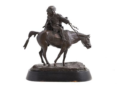 A BRONZE STATUE OF A CIRCASSIAN SOLDIER BY E. LANCERAY, CA. 1870. A statue by famed Russian 