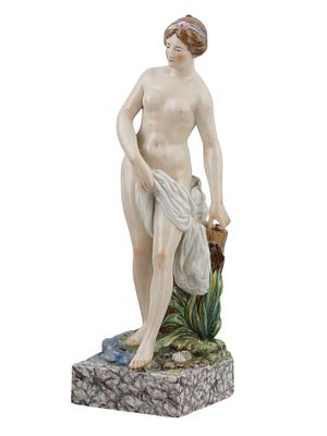 A ROYAL COOPENHAGER PORCELAIN FIGURE OF A STANDING NUDE. A Royal Copenhagen porcelain figure of