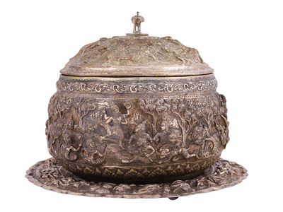 A BURMESE SILVER REPOUSSÉ LIDDED BOWL WITH ELEPHANT FINIAL, (MYANMAR), LATE 19TH CENTURY. A