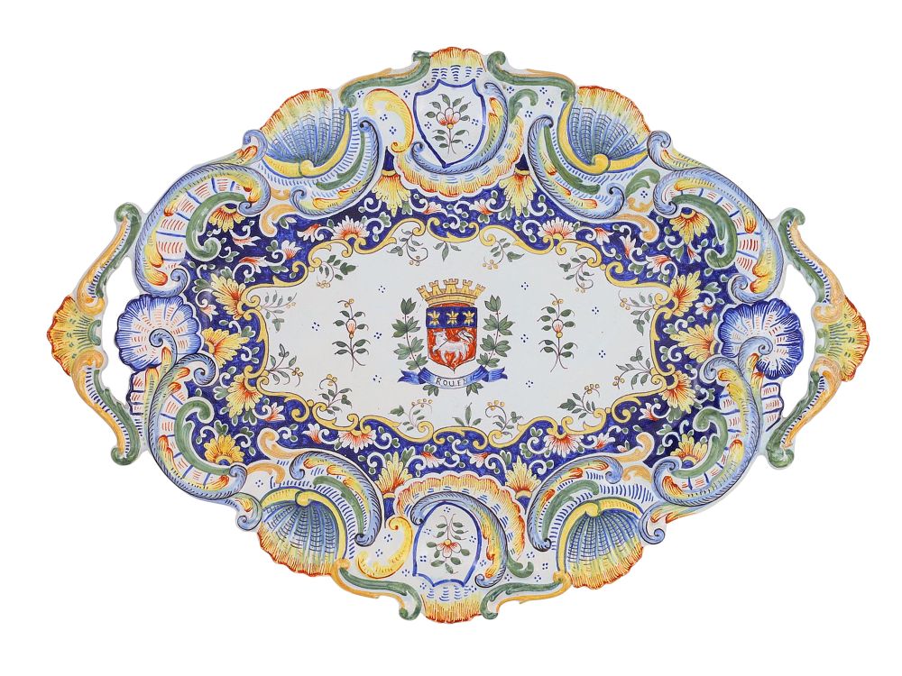A FRENCH FAIENCE ARMORIAL TRAY, ROUEN, 20TH CENTURY. Of lobed and scalloped form with twin 