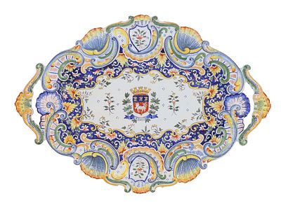 A FRENCH FAIENCE ARMORIAL TRAY, ROUEN, 20TH CENTURY. Of lobed and scalloped form with twin 