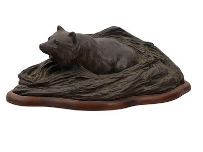 A SIGNED JAPANESE BRONZE OF A FOX IN ITS DEN, MEIJI PERIOD. Finely cast bronze group depicting a 