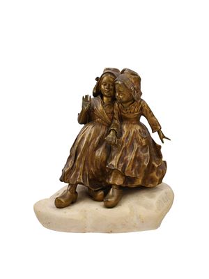 A JOSEPH D'ASTE (1881-1945) BRONZE FIGURE OF TWO DUTCH GIRLS, 20TH CEN. A bronze sculpture of 