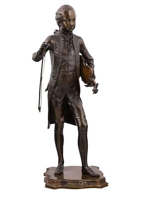 AN AUSTRIAN BRONZE FIGURE OF MOZART, SIGNED PAULI, EARLY 20TH CENTURY. Cast as the young 