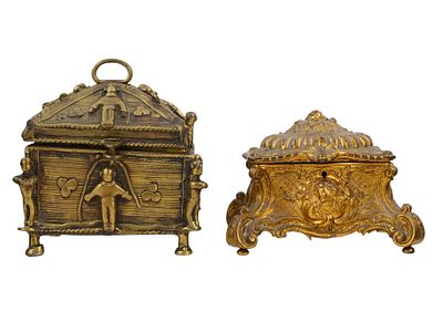 A PAIR OF LIDDED METAL CASKETS OF DIFFERING STYLE, 19TH/20TH CEN. Two lidded boxes from the 