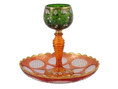 A BOHEMIAN MOSER GLASS CUP AND PLATE, LATE 19TH CENTURY. Comprising a goblet and a matching 