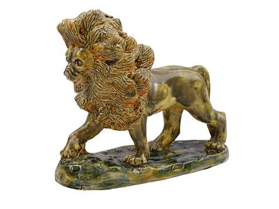 A P. ERSKINE SIGNED POTTERY LION, 1948. A glazed pottery lion with a long, billowing mane 