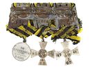 A GROUP OF THREE IMPERIAL RUSSIAN MILITARY AWARDS MOUNTED TOGETHER ON A STEEL BAR. A group of Image - 1