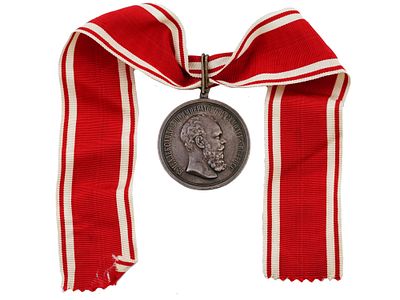 A RUSSIAN NECK SILVER MEDAL FOR ZEAL WITH RIBBON, ALEXANDER III. The obverse reads as: "Б.М. 