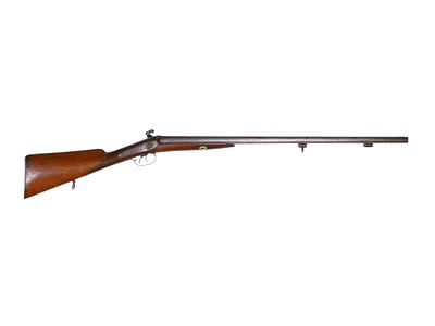 A 19TH CENTURY DOUBLE BARRELED PERCUSSION SHOTGUN. A double-barreled percussion shotgun with a 