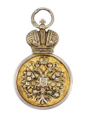 A RUSSIAN SILVER REGIMENTAL BADGE, 1906. Imperial Russian graduation jetton badge, dated 1906 