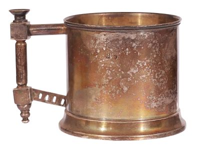A RUSSIAN GILT-SILVER TEA GLASS HOLDER WITH PAN-SLAVIC STYLE HANDLE. Of cylindrical form with 