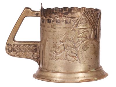 A RUSSIAN WHITE METAL ALLOY TEA GLASS HOLDER, ZASTAVA. Cast and embossed with a continuous scene 