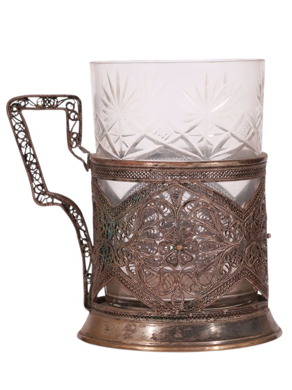 A RUSSIAN SILVER TEA GLASS HOLDER WITH OPENWORK FILIGREE DESIGN. The cylindrical holder finely 