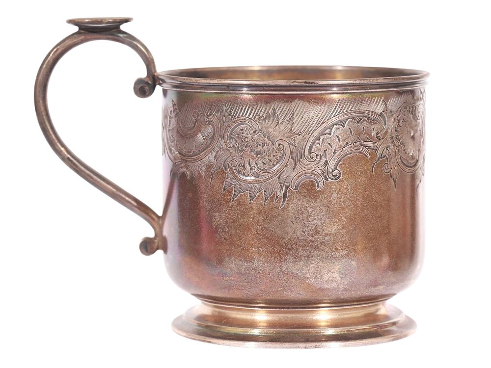 A RUSSIAN PARCEL-GILT SILVER TEA GLASS HOLDER. Cylindrical form with flared foot and delicate 