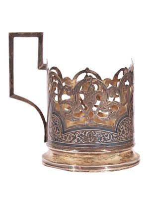 A RUSSIAN PARCEL-GILT SILVER AND NIELLO TEA GLASS HOLDER. A Russian parcel-gilt silver and 