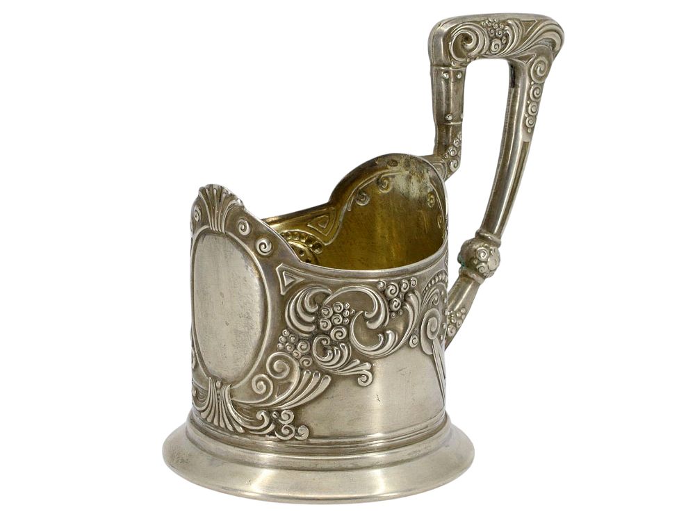 A RUSSIAN ART NOUVEAU PARCEL-GILT SILVER GLASSHOLDER, 2ND MOSCOW ARTEL. Of cylindrical form with 