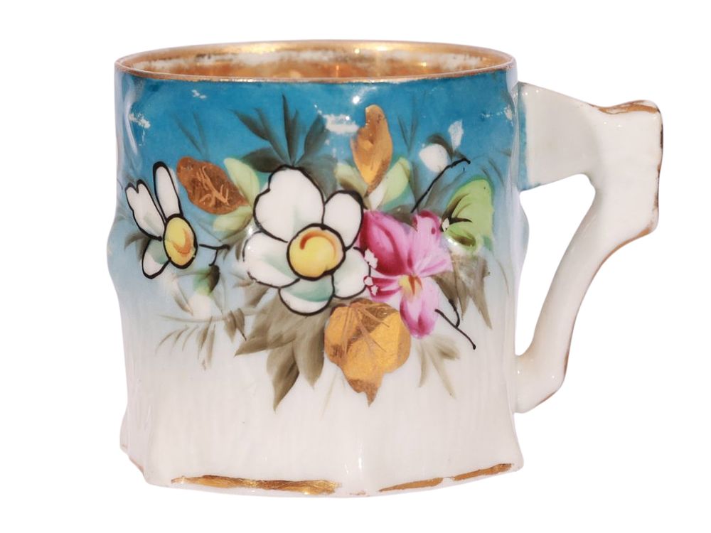 A KUZNETSOV GILT AND PAINTED PORCELAIN COFFEE CUP. A finely modeled porcelain coffee cup by the 