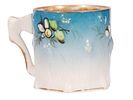 A KUZNETSOV GILT AND PAINTED PORCELAIN COFFEE CUP. A finely modeled porcelain coffee cup by the Изображение - 1