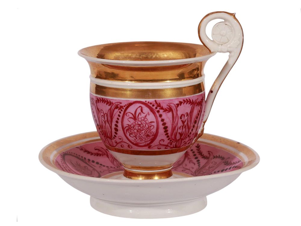 A LARGE RUSSIAN HAND-PAINTED AND GILT TEACUP AND SAUCER BY THE SAFRONOV FACTORY. A Russian 