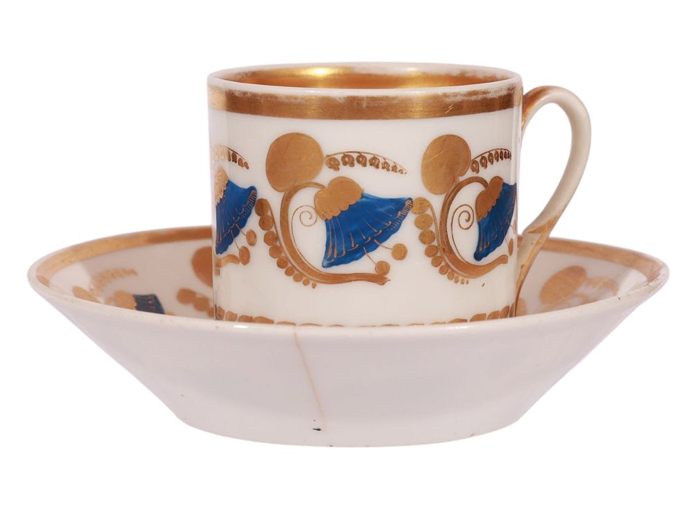 A RUSSIAN GILT-PAINTED PORCELAIN CUP AND SAUCER, CA. 1815 - 1830. A nice porcelain coffee cup 