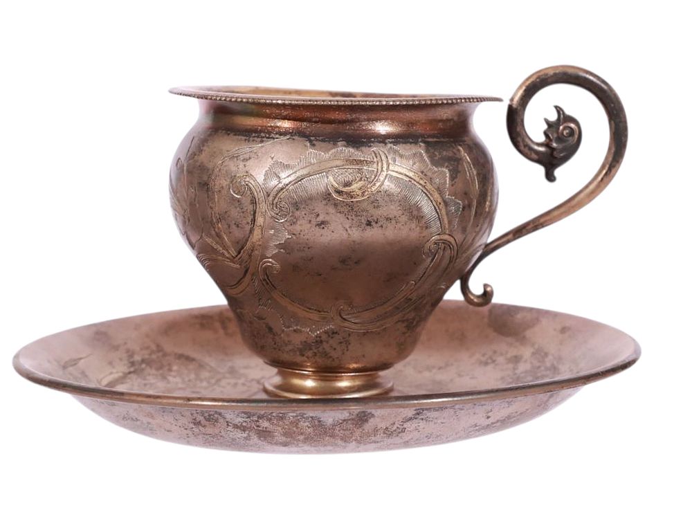 A RUSSIAN PARCEL GILT-SILVER CUP AND SAUCER, 19TH CEN. A Russian parcel gilt-silver tea cup 