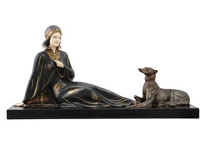 AN ART DECO SCULPTURE OF A YOUNG WOMAN WITH A GREYHOUND, CA. 1930. Painted metal sculpture of a 