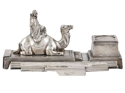 A WHITE METAL ART DECO MOUNTED ARAB INKWELL. French white metal inkwell decorated with a figure 