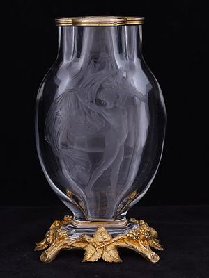 A FINE ENGRAVED GLASS VASE WITH GILT BRONZE MOUNT, 19TH CENTURY. The ovoid clear glass body is 