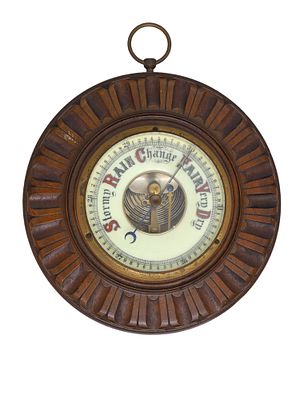 AN ANTIQUE ANEROID BAROMETER IN A WOOD FRAME, CA. 1900. This is a vintage barometer, probably 