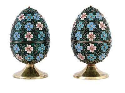 TWO SOVIET RUSSIAN GILT SILVER AND CLOISONN&Eacute; ENAMEL EASTER EGGS ON STANDS. Pair of Russian 