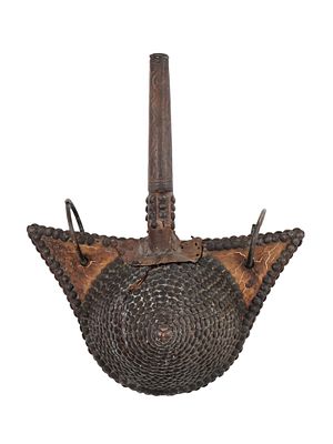 A 19TH CENTURY MOROCCAN GUNPOWDER FLASK. This antique gunpowder flask has a unique and unusual 