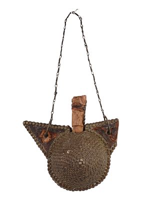 A 19TH CENTURY MOROCCO GUNPOWDER FLASK. This antique gunpowder flask has a unique and unusual 