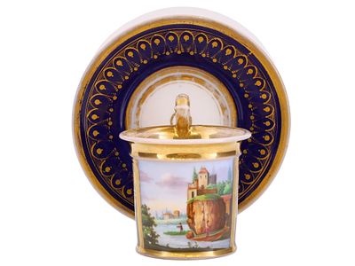 A FRENCH PORCELAIN CUP AND SAUCER WITH COBALT-BLUE GROUND AND LANDSCAPE PANEL, EARLY 19TH CENTURY. 