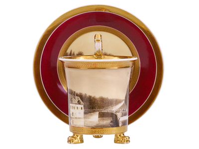 A FRENCH PORCELAIN CUP AND SAUCER WITH GILT AND SEPIA LANDSCAPE DECORATION, FRANCE, 19TH CENTURY. 
