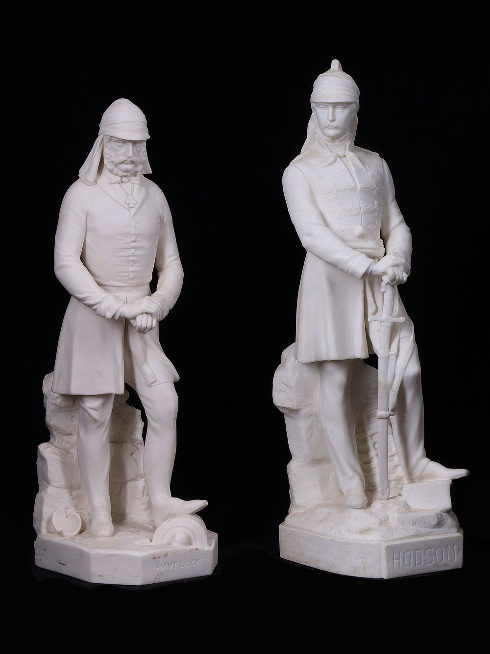 A PAIR OF VICTORIAN ENGLISH PARIAN WARE FIGURES, HODSON AND HAVELOCK, INDIA COLONIALISM. A pair 