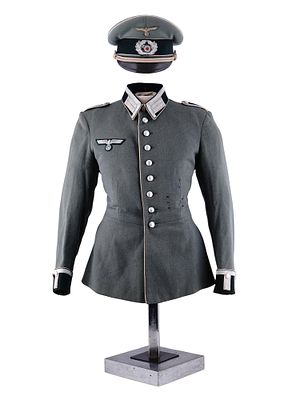 A GERMAN WEHRMACHT ARMY OBERLEUTNANT DRESS TUNIC AND VISOR CAP. A German Wehrmacht Heer (Army) 