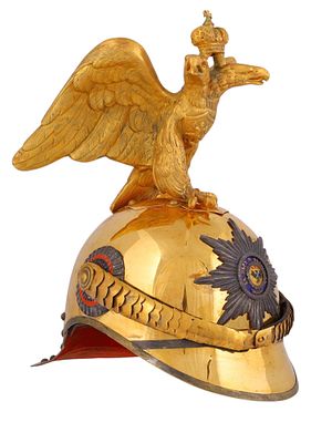 A RUSSIAN IMPERIAL LIFE GUARD OFFICER HELMET, 20TH CENTURY. Formed of gilded metal with high 