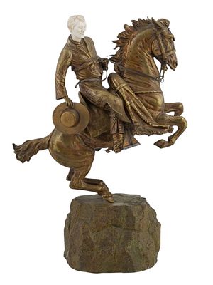 A LARGE GILT-BRONZE MOUNTED FIGURE WITH A CARVED FACE. This mounted figure with a carved head 