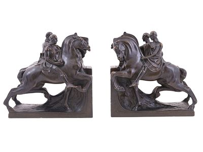 A PAIR OF PATINATED SPELTER FIGURAL BOOKENDS WITH EQUESTRIAN GROUPS, FRENCH, ART DECO PERIOD 