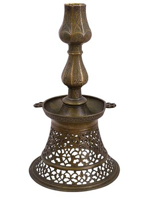 AN OTTOMAN OPENWORK BRONZE CANDLESTICK, TURKEY, 16TH–17TH CENTURY. The candlestick with 