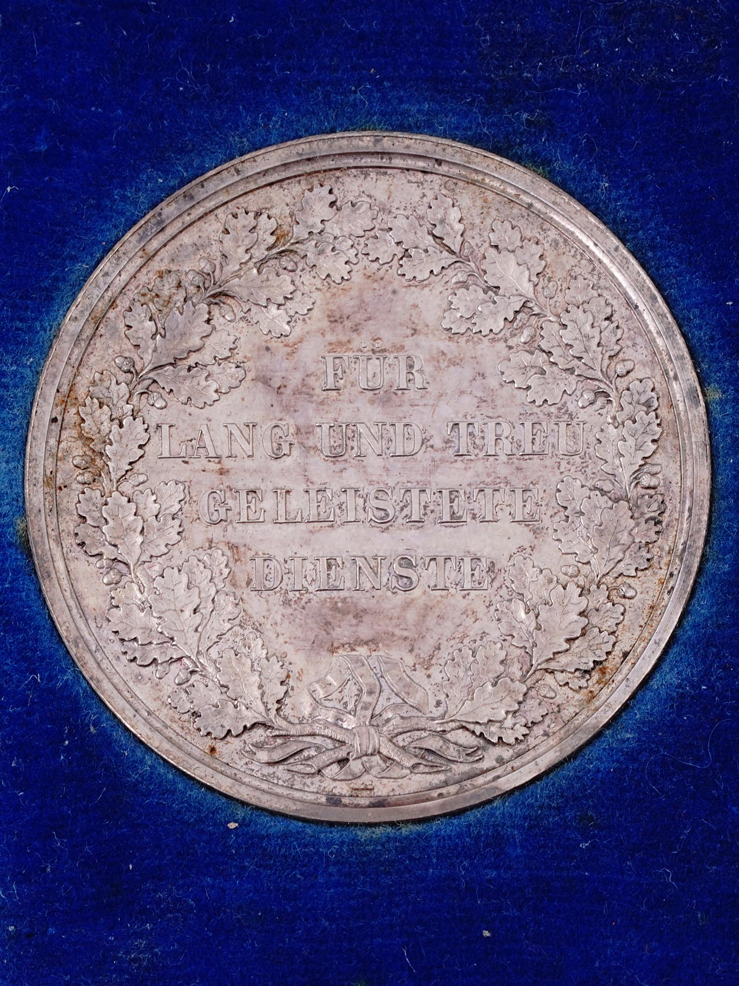 A CASED 1895 MUNICH LONG SERVICE TABLE MEDAL IN SILVER