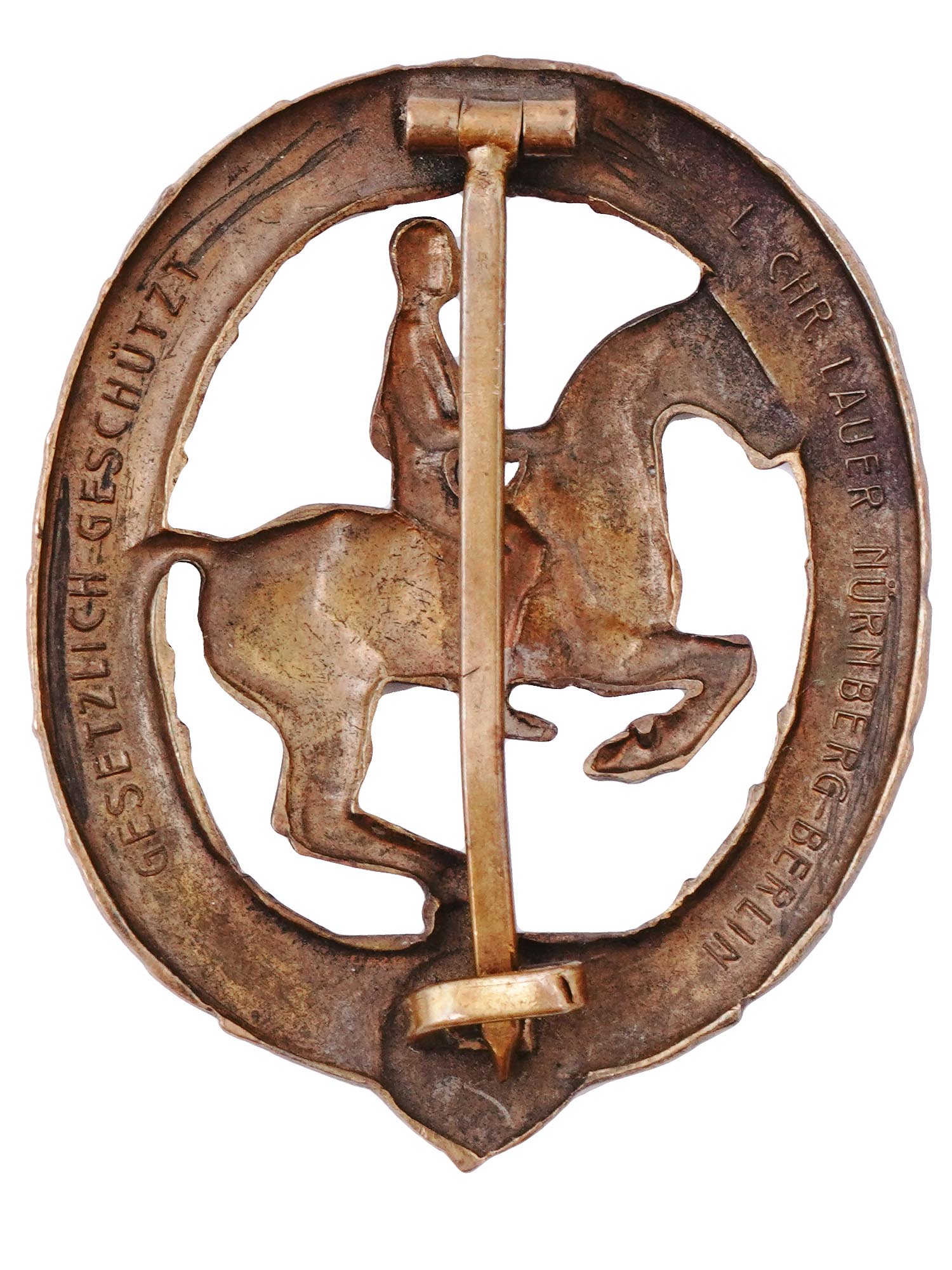 A GERMAN EQUESTRIAN BADGE IN BRONZE WITH CERTIFICATE