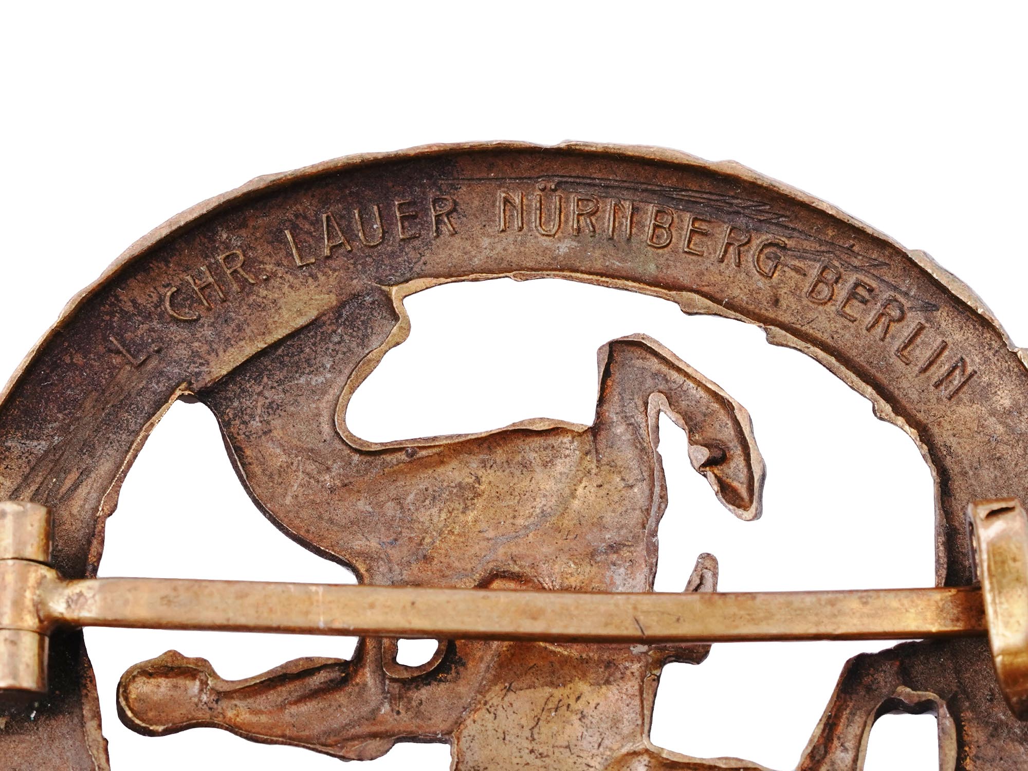 A GERMAN EQUESTRIAN BADGE IN BRONZE WITH CERTIFICATE