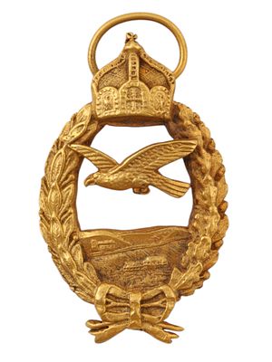 A WWI GERMAN NAVAL PILOT RETIRED SERVICE PRINZEN 800 BADGE. Oval silver-gilt badge depicting a 